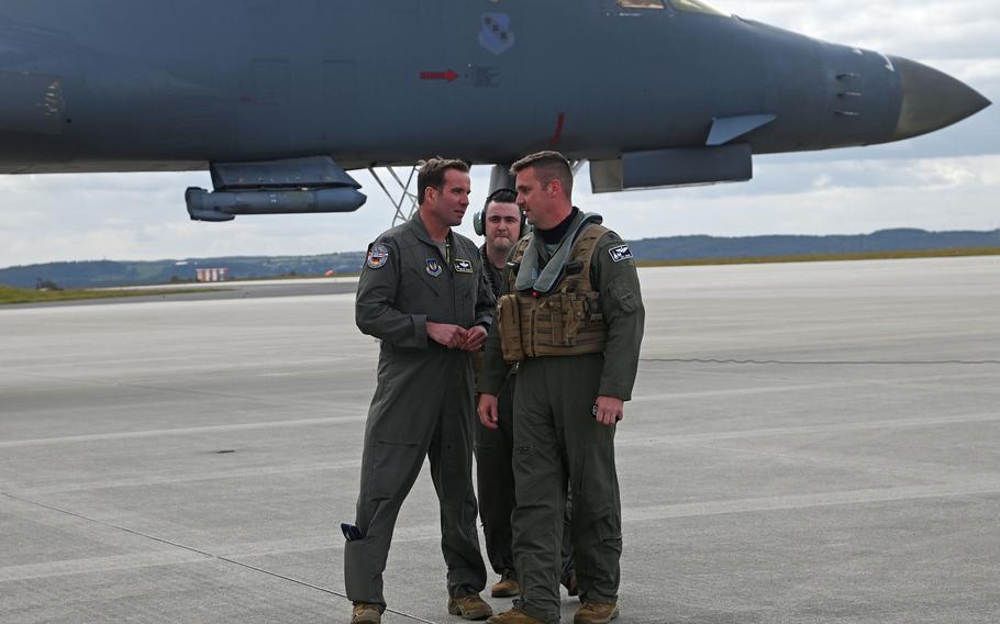 Col. Leslie Hauck, commander of the 52nd Fighter Wing at Spangdahlem Air Base, Germany, left, talks with B-1B Lancer crew members from the 9th Expeditionary Bomb Squadron after they landed at the base, Oct. 11, 2021. 