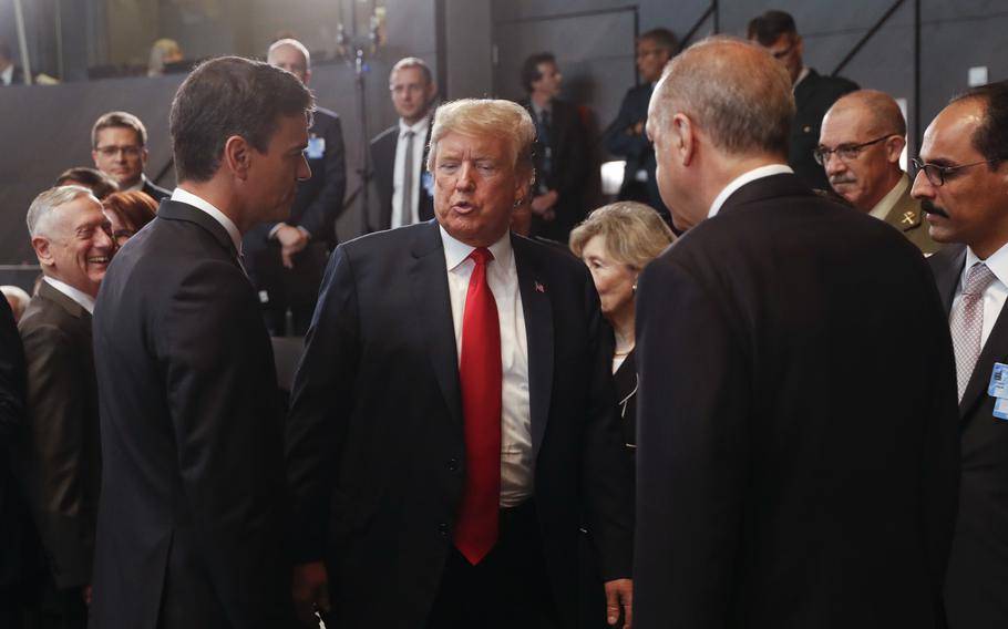 President Donald Trump talks with Spanish Prime Minister Pedro Sanchez and Turkey’s President Recep Tayyip Erdogan at a meeting of the North Atlantic Council at NATO headquarters in Brussels on July 11, 2018. 