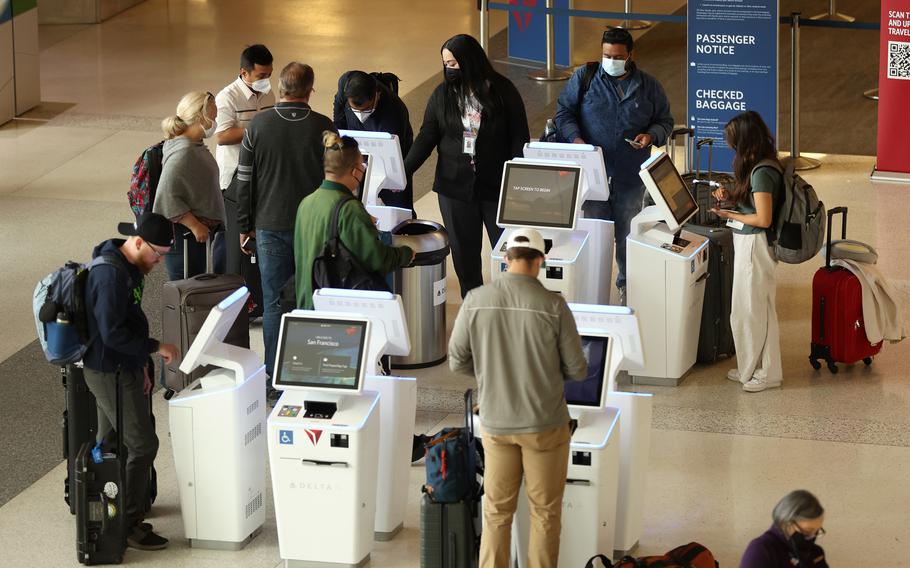 Delta Airlines customers check in for flights at San Francisco International Airport on May 12, 2022, in San Francisco, California. (Justin Sullivan/Getty Images/TNS)