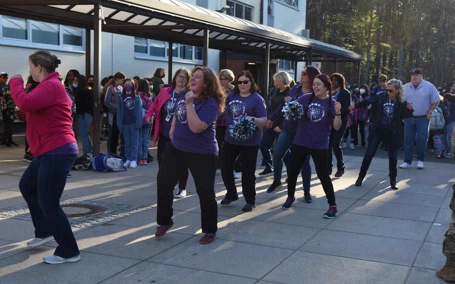 Staff members at Ramstein Intermediate School in Germany join a flash mob dance while celebrating Month of the Military Child on Tuesday, April 19, 2022.