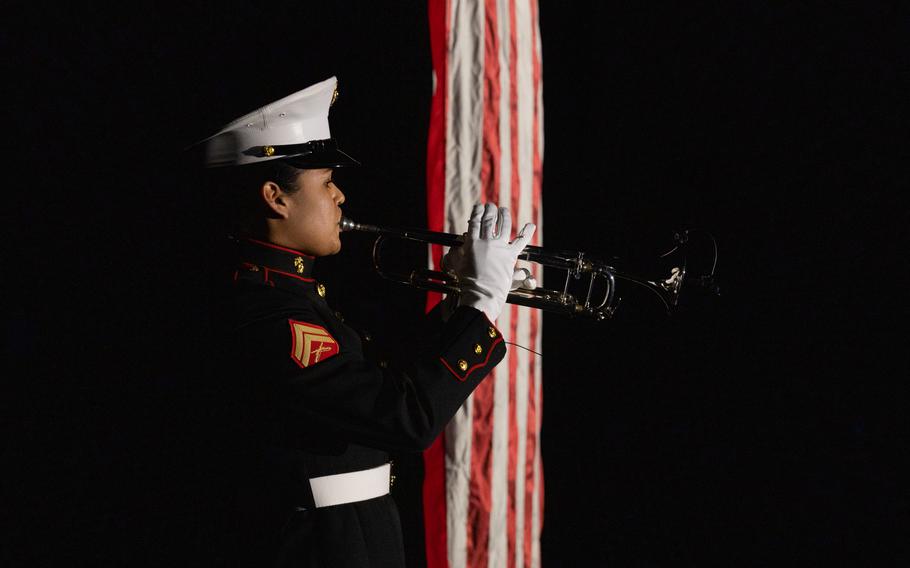 U.S. Marine Corps Cpl. Jerilyn A. Flores, a trumpet instrumentalist with the Quantico Marine Corps Band, performs Taps during the Virginia International Tattoo in Norfolk, Va., April 19, 2023. The Virginia International Tattoo is an annual military music and arts festival featuring performances by military bands, drill teams, dancers and artists from around the world. 