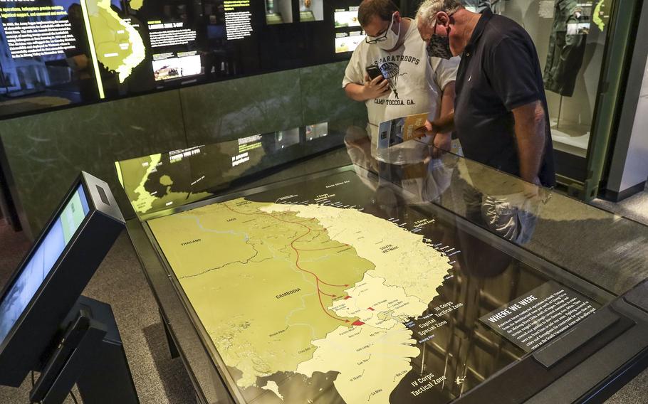 Two visitors to the National Museum of the United States Army look at a map of Vietnam on June 14, 2021.