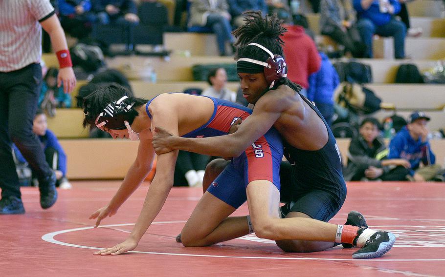 Vilseck's Nicholas Mayfield holds onto Ramstein's Deklan Duboise during a 132-pound match at a wrestling meet on Jan. 27, 2024, at Kaiserslautern High School in Kaiserslautern, Germany.