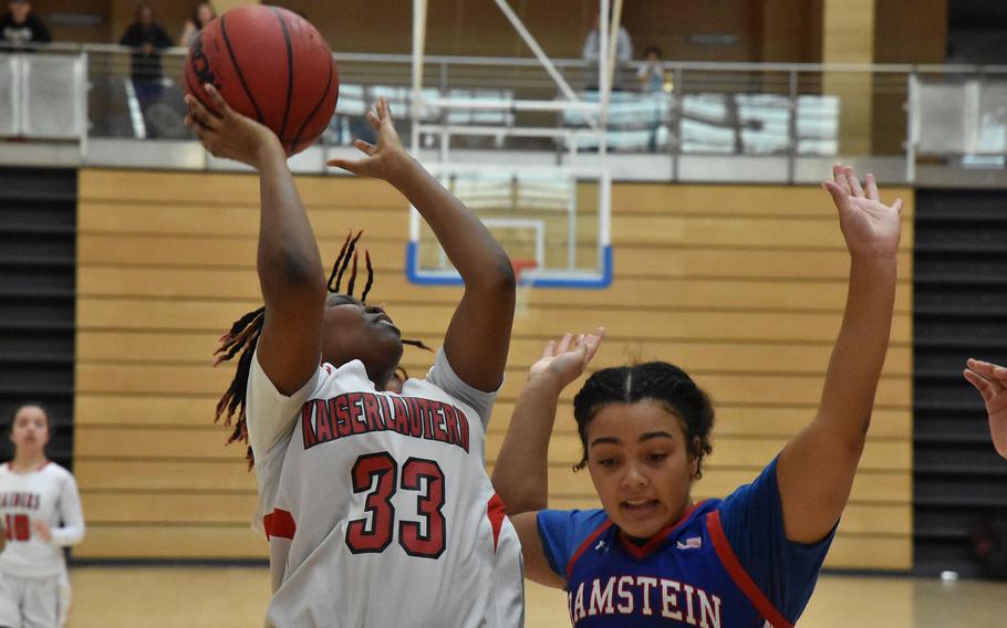 Kaiserslautern’s Vernesha Oliver scores after a steal to keep the Raiders close in a Division I semifinal game with Ramstein on Friday, Feb. 16, 2024, at the DODEA European Basketball Championships in Wiesbaden, Germany. The Royals’ Parker Ingram defends.