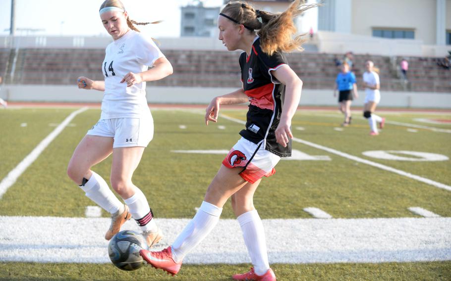 Rosie McGrath kicks the ball.