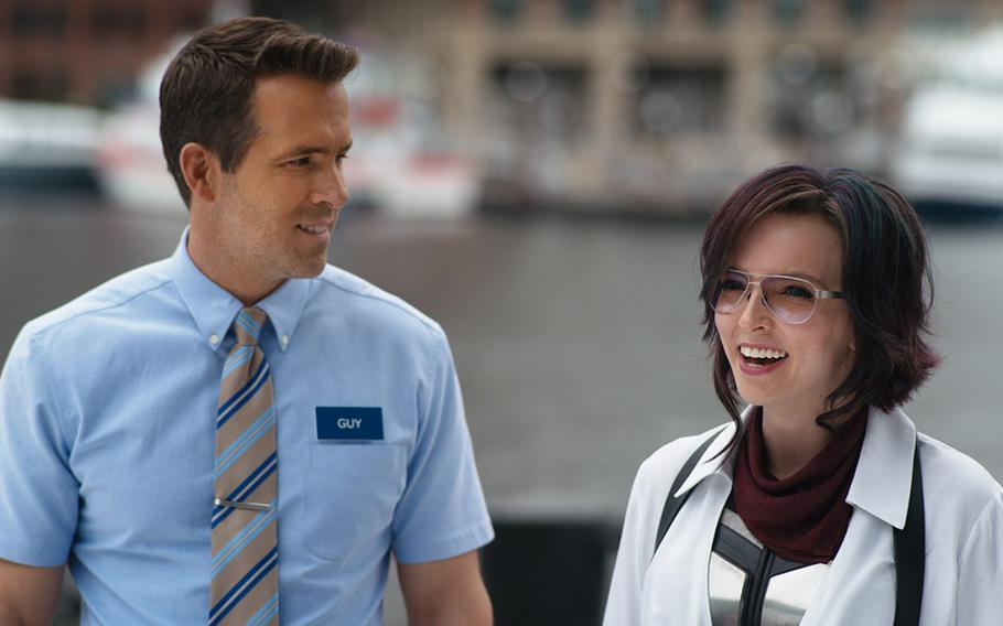 Ryan Reynolds (left) and Jodie Comer in "Free Guy." 