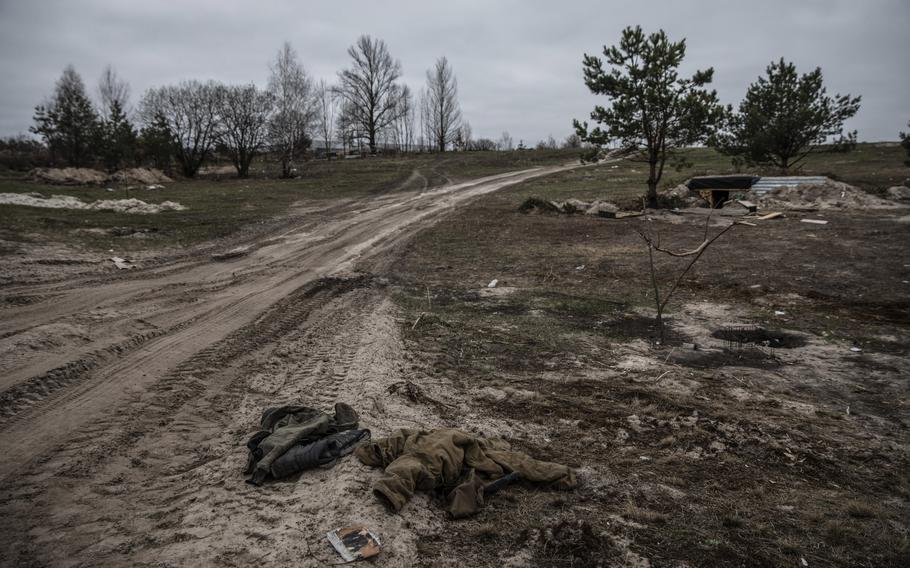 A Russian uniform lies in an area where Moscow’s forces set up a large camp on the outskirts of Vorzel.