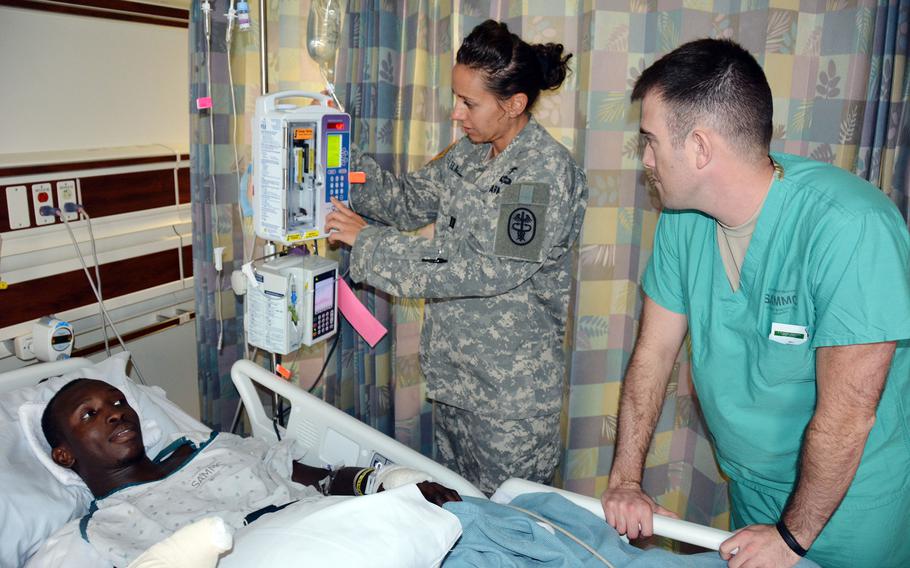 Then-U.S. Army Capt. Kelly Elmlinger checks on a patient at Brooke Army Medical Center in San Antonio, Oct. 23, 2015.