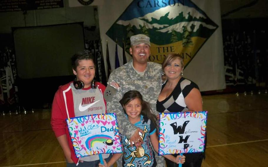 Army veteran Richard Fierro is shown with his family in this undated picture. Fierro was one of two men who rushed to confront and subdue the gunman at the Club Q shooting in Colorado Springs on Saturday, Nov. 19, 2022. 
