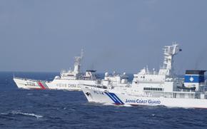 The Japan Coast Guard approaches a Chinese coast guard ship in Japanese territorial waters in this undated photo.
