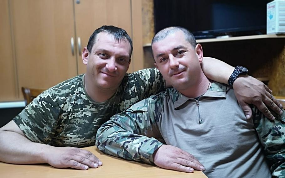Serhi Lapko, left, and Vitaliy Khrus share stories about the struggles their men faced on the front line in Ukraine. 