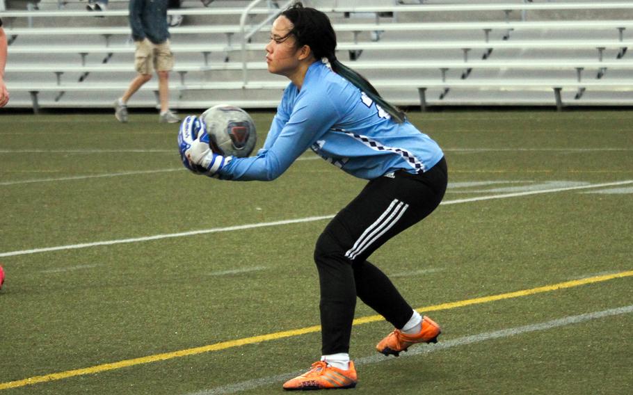 Mia Dorn grabs a shot on goal.