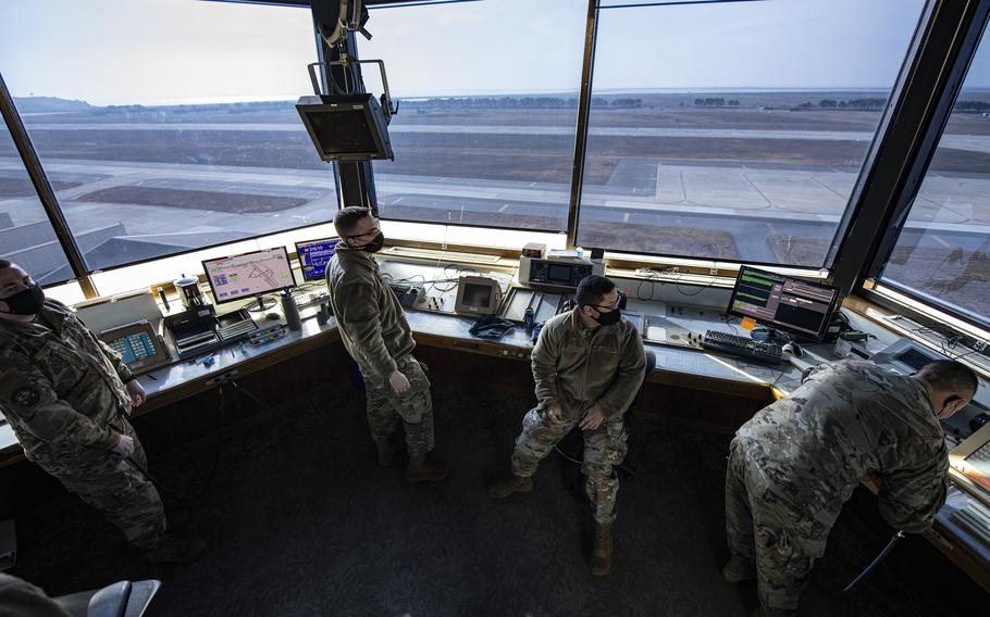 Air traffic controllers wear masks while directing aircraft at Kunsan Air Base, South Korea, Jan. 10, 2022.