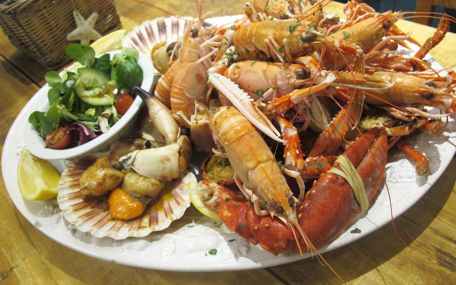 The seafood platter at the pub of the Lochindaal Hotel comes piled high with langoustines, mussels, crab claws, scallops and a whole lobster. 