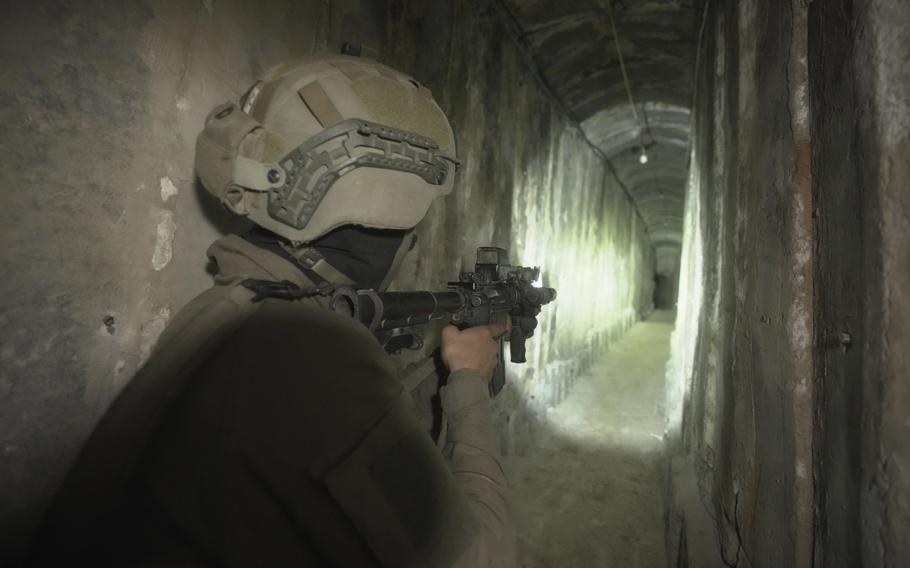 Israeli soldiers show the media an underground tunnel found underneath Shifa Hospital in Gaza City, Wednesday, Nov. 22, 2023. 