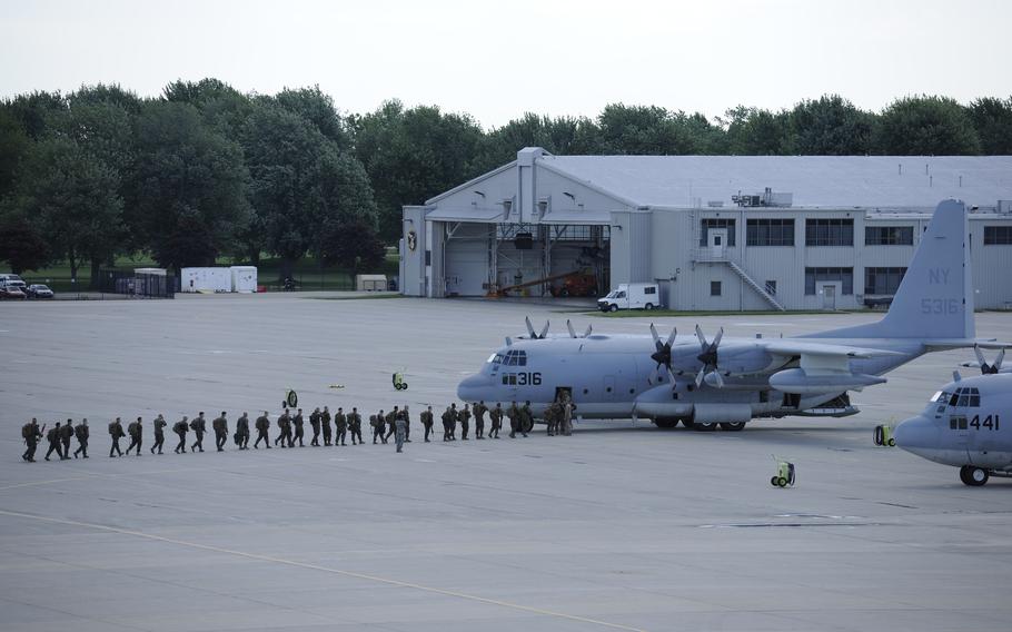 Marines from the 1st Battalion 24th Marines prepare to depart their home station of Selfridge Air National Guard Base, Mich., on Aug. 4, 2015.
