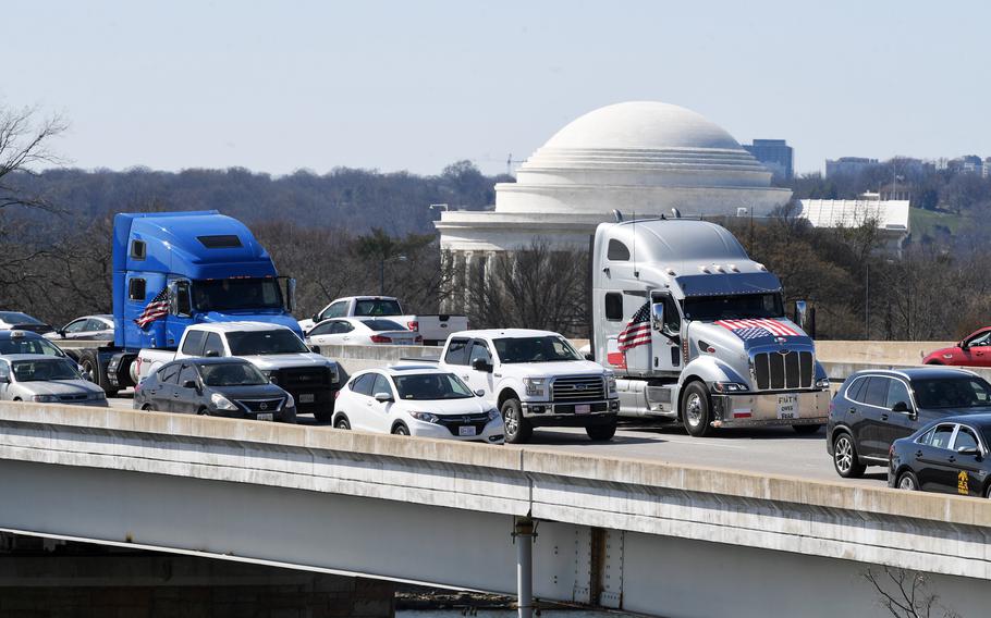 The truck convoy and other traffic travel along Interstate 395 North in Washington last week. 