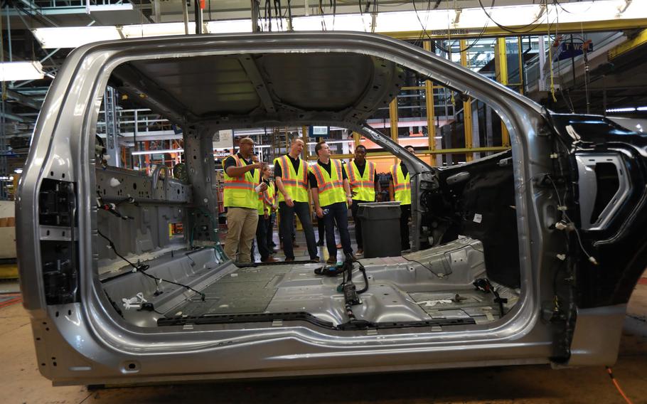 Blue Angels pilots tour the Ford Motor Co. Dearborn Truck plant assembly line on Aug. 3, 2021.