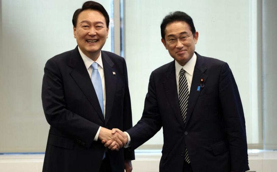 South Korean President Yoon Suk Yeol, left, and Japanese Prime Minister Fumio Kishida pose during their first summit in New York, N.Y., Sept. 21, 2022. 