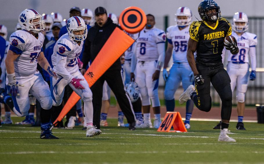 Stuttgart's Jordan McCullough, right, breaks through the Ramstein defense in the last Division I football championship game played in DODEA Europe on Nov. 2, 2019. Stuttgart won the game in Kaiserslautern, Germany, 30-0. 