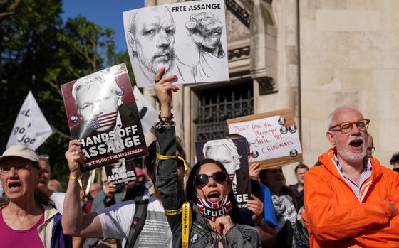 People attend a protest outside the High Court on the day of an extradition hearing of WikiLeaks founder Julian Assange, in London, Britain, May 20, 2024. REUTERS/Maja Smiejkowska