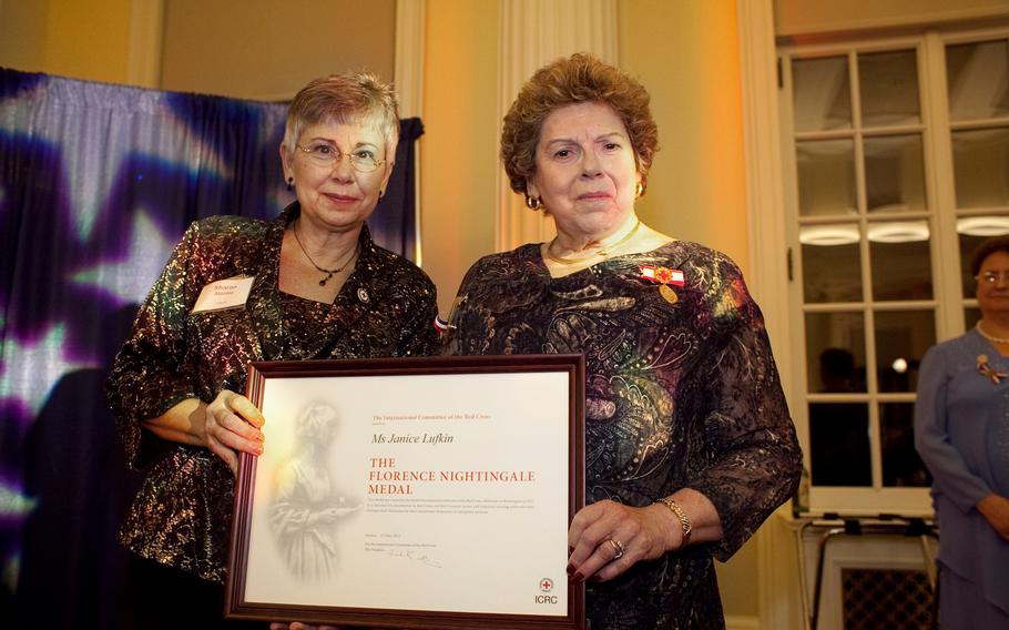 Janice Lufkin (right) is awarded the Florence Nightingale Medal by the American Red Cross on Nov. 3, 2011 in Philadelphia, Pa. Lufkin served in the Navy Nurse Corps from 1966 to 1992 and earned a dozen medals, stars, ribbons and citations, including the Meritorious Service Medal and the National Defense Service Medal. 