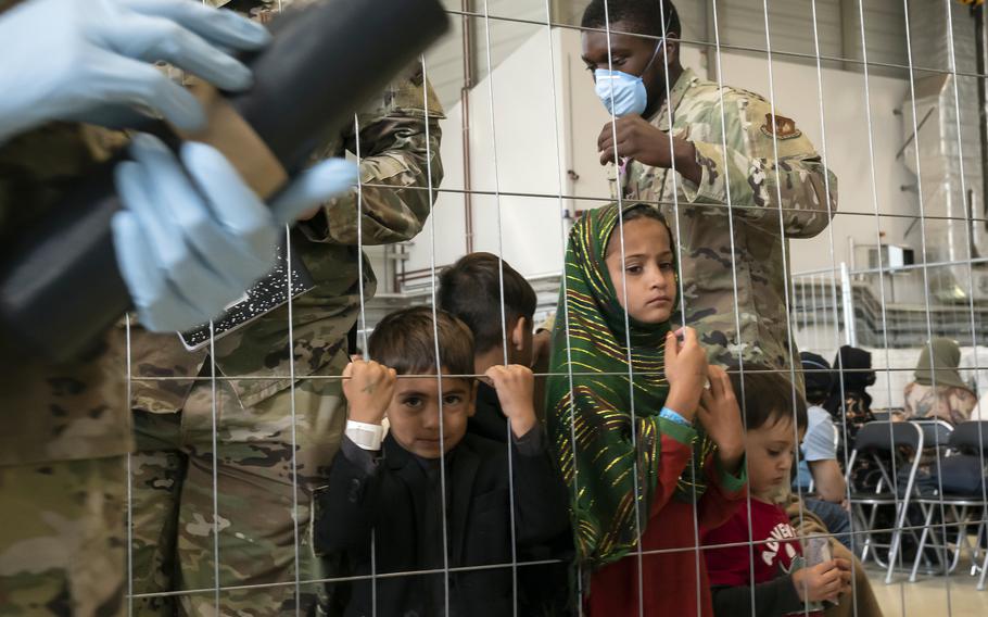 Afghan children wait to be flown from Ramstein Air Base, Germany, to the United States on Aug. 30, 2021. Some 15,000 Afghans were in transit at the base on Monday after fleeing Afghanistan.