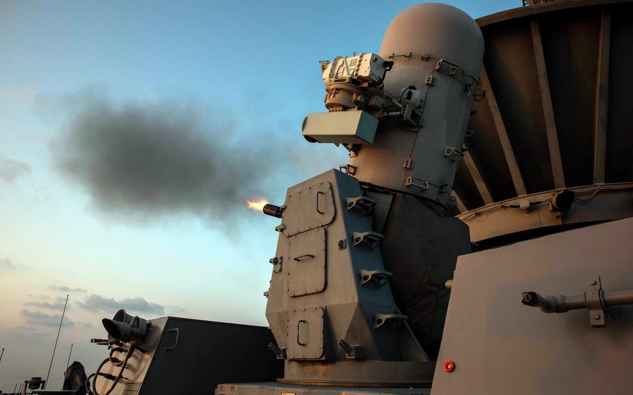 A close-in weapons system fires aboard the amphibious assault ship USS Makin Island in waters near the Philippines, Saturday, April 15, 2023.