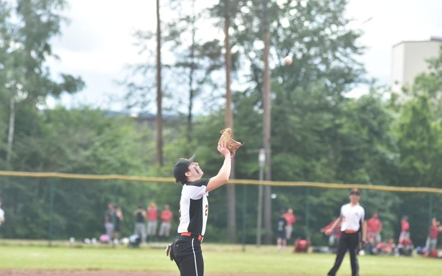 Spangdahlem third baseman Michael Landers waits for the ball to fall into his mitt in the DODEA European Division II/III championship game Friday, May 24, 2024, at Ramstein Air Base, Germany.