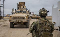 A U.S. Soldier, with Alpha Company, 1st Battalion, 6th Infantry Regiment, 2nd Armored Brigade Combat Team, 1st Armored Division, in the Central Command (CENTCOM) area of responsibility, walks toward a M2 Bradley Infantry Fighting Vehicle in Northeastern Syria on Dec. 16, 2020. The soldiers are in Syria to support the Combined Joint Task Force-Operation Inherent Resolve (CJTF-OIR) mission. CJTF remains committed to working by, with, and through our partners to ensure the enduring defeat of Daesh. (U.S. Army Reserve photo by Spc. Tarako Braswell)