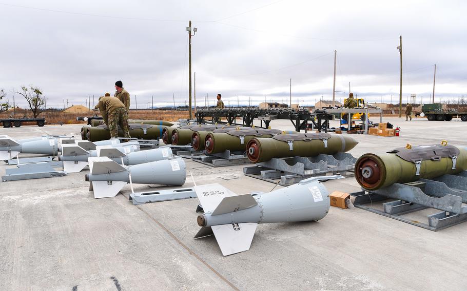 Airmen prep inert BLU-109 penetrator bombs during an exercise.