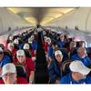Eastern Iowa Honor Flight participants fill the seats of an airplane that took them to and from the Nation’s Capitol on Sept. 20, 2023, for a tour of the area’s war memorials.