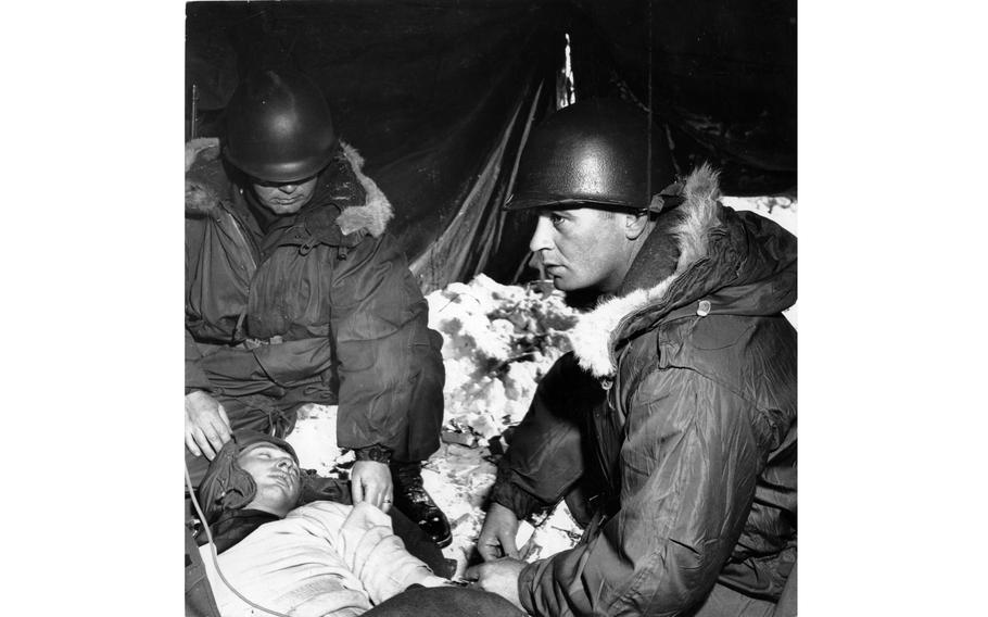 Soldiers apply plasma to a “wounded” man.