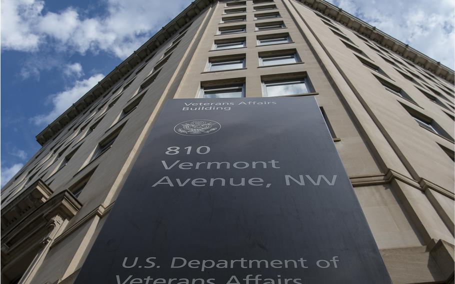 An entrance sign on the Department of Veterans Affairs building, seen from below.