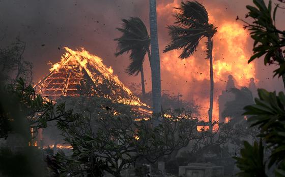 FILE - Waiola Church and nearby Lahaina Hongwanji Mission are engulfed in flames along Wainee Street, Aug. 8, 2023, in Lahaina, Hawaii.  (Matthew Thayer/The Maui News via AP, File)