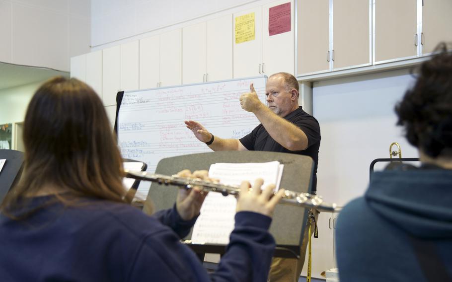 Brad Harzman, band director for Camp Zama Middle/High School, works with his students at the Army post outside Tokyo, Oct. 19, 2023. 