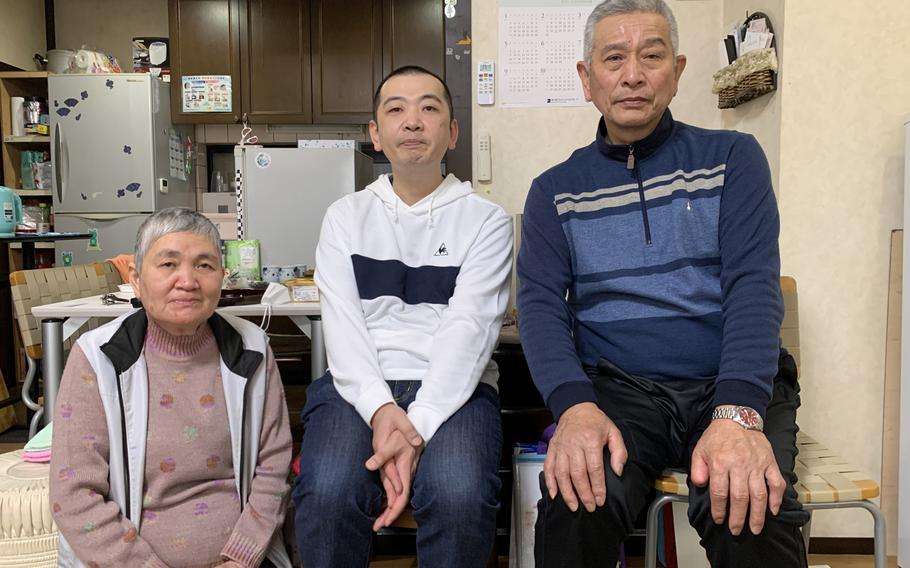 Sumiko Ohata, son Takashi and husband Masahiro in their home in Kanazawa, Japan. 