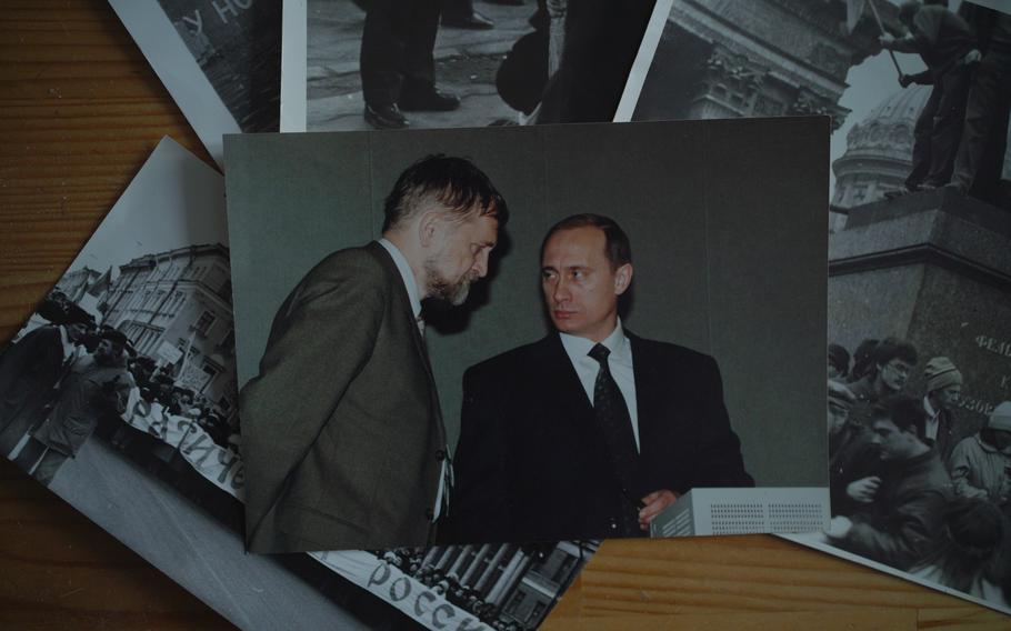 Pictures belonging to Yuly Rybakov, a dissident who was involved in a 1976 case that was investigated by a young KGB officer named Lt. Putin, shown at Rybakov's apartment in St. Petersburg on Dec. 15, 2022. Rybakov was a lawmaker when he met Vladimir Putin, then acting president, in early 2000.