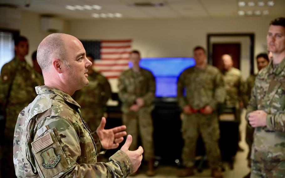 Chief Master Sgt. Jeremiah Grisham, 521st Air Mobility Operations Wing command chief, speaks with airmen of the 728th Air Mobility Squadron at Incirlik Air Base, Turkey, on May 3, 2022. Grisham, as far as he knows, is the only openly gay command chief in the Air Force.
