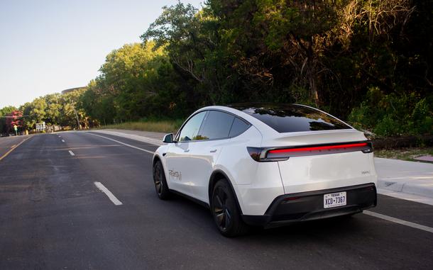 A Tesla Inc. robotaxi drives down the road.