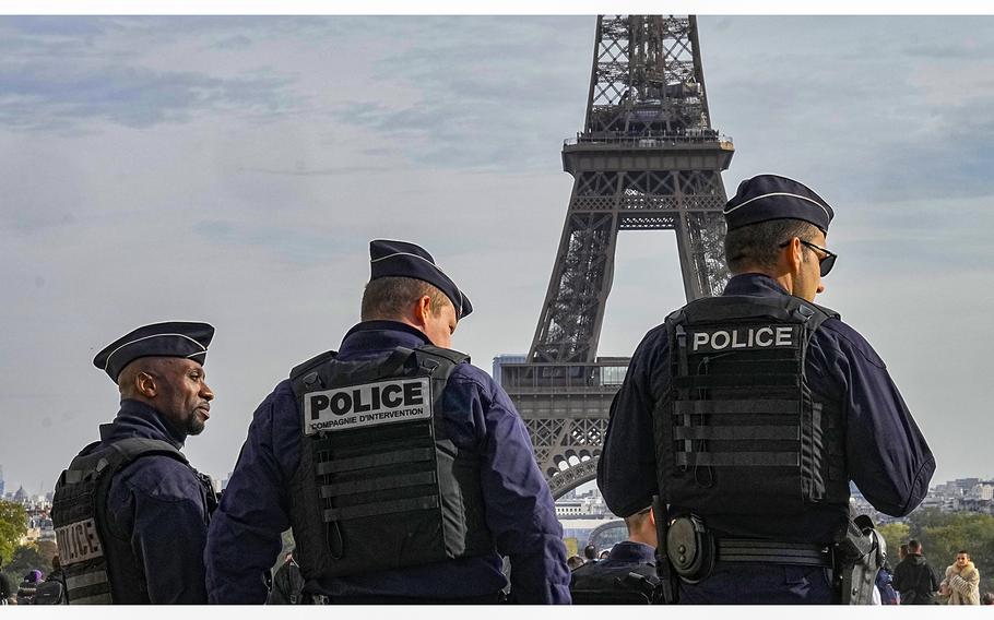 Police officers patrol the Trocadero plaza near the Eiffel Tower in Paris, on Oct. 17, 2023. France says it has asked 46 countries if they can supply more than 2,000 police officers to help secure the Paris Olympics. 