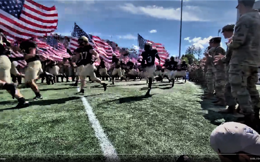 The Black Knights carry American flags onto the field at Michie Stadium ahead of their game against Western Kentucky on Saturday, Sept. 11, 2011, in West Point, N.Y.