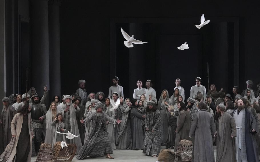Rochus Rueckel as Jesus, left, performs with the cast during the rehearsal of the 42nd Passion Play in Oberammergau, Germany, Wednesday, May 4, 2022. Almost half of the village’s residents — more than 1,800 people including 400 children — will participate. 