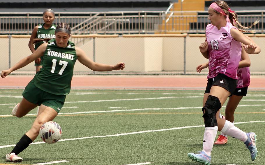 Kubasaki's Reighlyn Kissick gets set to boot the ball past Kadena's Sydney Pontious.