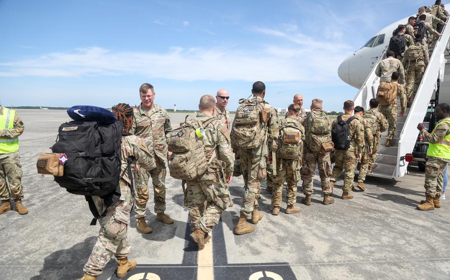 Soldiers of the 24th Ordnance Company board a flight to Europe from the Air Dominance Center in Savannah, Ga., June 12, 2023, to support operations along NATO’s eastern flank. New NATO defense plans require a force structure with over 300,000 allied troops at high readiness, NATO Secretary-General Jens Stoltenberg said Wednesday, June 14. 