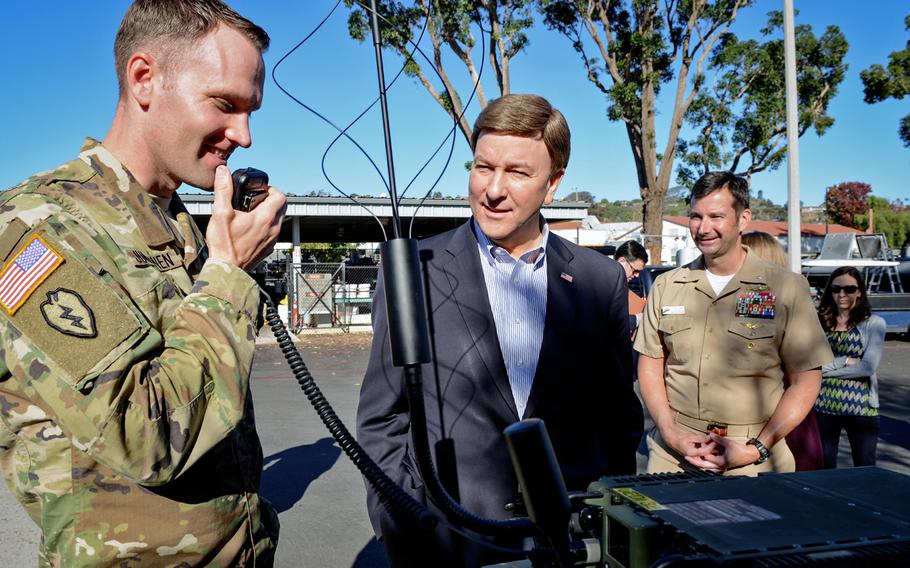 Lt. Col. Bryan Juntunen (left) conducts a demonstration for Rep. Mike Rogers, R-Ala., (right) in 2016 at the Space and Naval Warfare Systems Center Pacific in San Diego. Rogers was named chairman of the House Armed Services Committee on Tuesday, Jan. 10, 2022. 