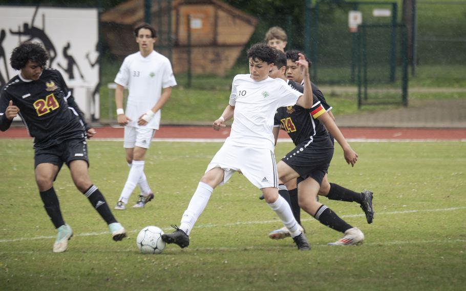 Adrian Marugal tries to split defenders.