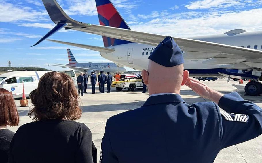 Sean T. Stevenson, a retired U.S. Air Force chief master sergeant, salutes as his son Sean “Ryan” Stevenson’s casket is unloaded from an airplane. The younger Stevenson took his own life Nov. 1, 2023, at Cannon Air Force Base, N.M. With Stevenson are his wife and daughter.
