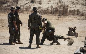 Members of the 3rd Marine Littoral Regiment practice hand-to-hand comabt during a Balikatan drill at the La Paz Sand Dunes in Laoag, Philippines, May 8, 2024. 
