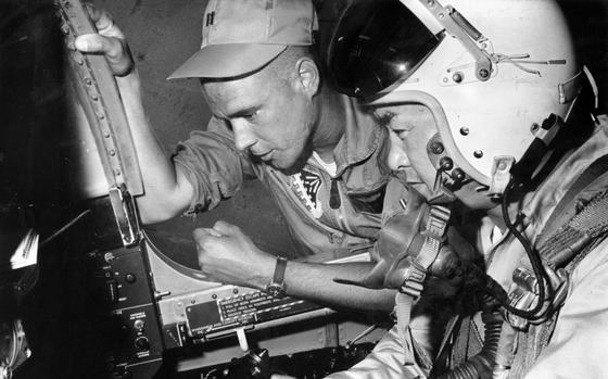 Suwon Air Base, South Korea, June 1962: Capt. Lachlan MacLeay, operations officer of Detachment 2, 6246th Air Force Advisory Group at Suwon Air Base, Korea, checks out Col. Sun Hyok Rhim, director of operations, 10th ROK Fighter Wing, in an F-86D flight simulator. The giant electronic device lets pilots check flying procedures on the ground. The small 40-man detachment advises Republic of Korea (ROK) Air Force units in every phase of their operation from security to actually flying their jet fighters and reconnaissance planes. 

Looking for Stars and Stripes’ historic coverage? Subscribe to Stars and Stripes’ historic newspaper archive! We have digitized our 1948-1999 European and Pacific editions, as well as several of our WWII editions and made them available online through https://starsandstripes.newspaperarchive.com/

META TAGS: Pacific; South Korea; Detachment 2; 6246th Air Force Advisory Group; 10th ROK Fighter Wing; U.S. Air Force; maintenance; flight simulation; U.S. - South Korean relations; military cooperation